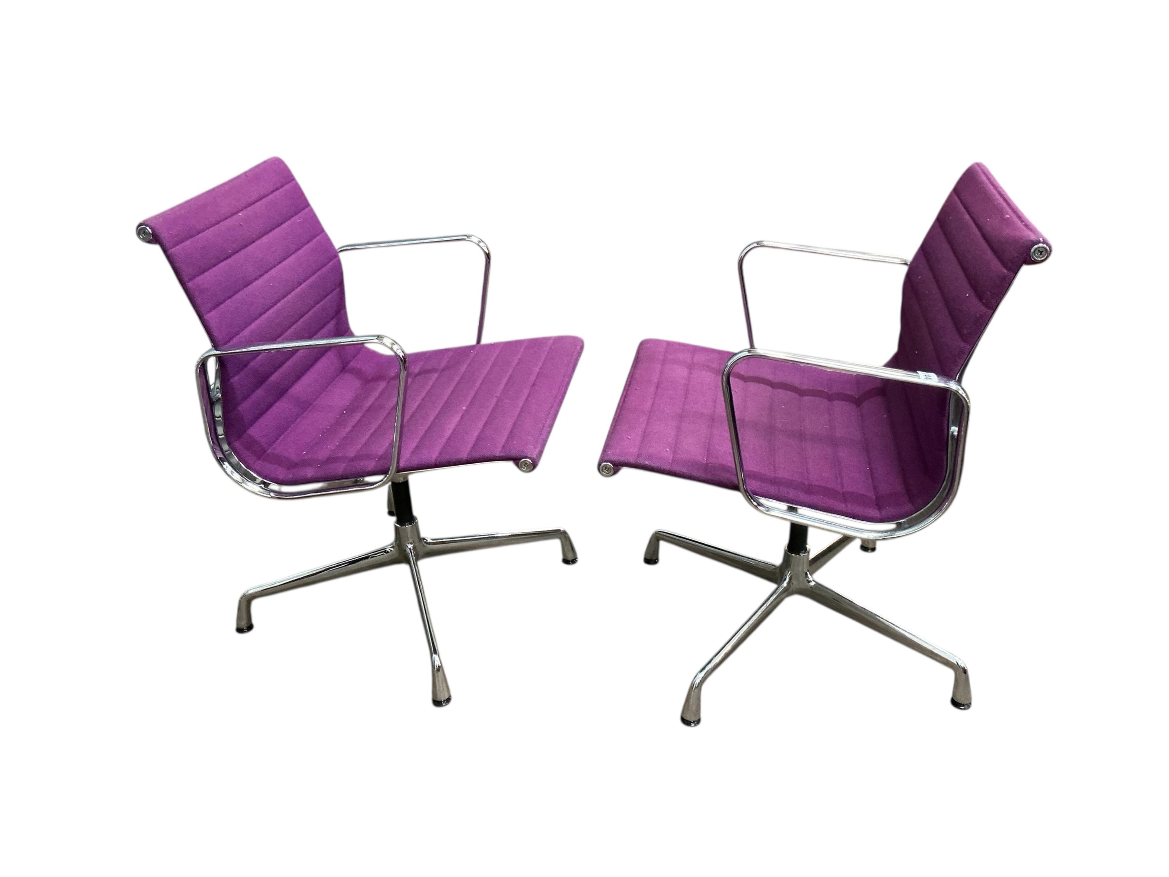 Charles Eames for Vitra, a pair of chrome swivel desk chairs on four prong bases, width 57cm, depth 50cm, height 82cm